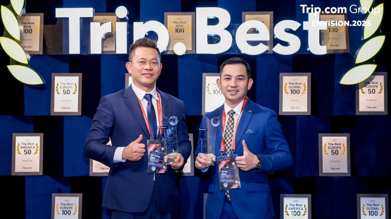EHM management team holding the awards