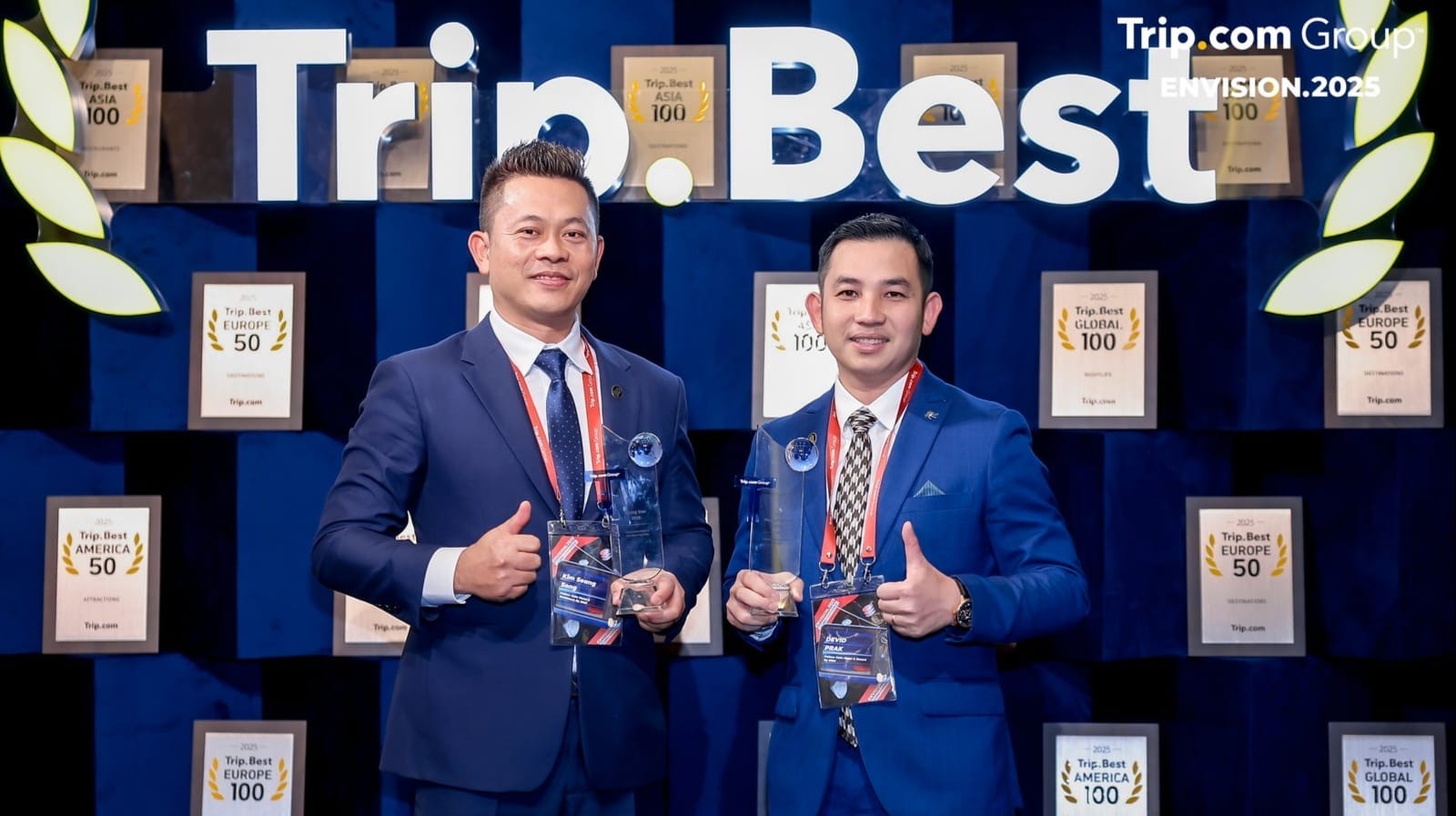 EHM management team holding the awards